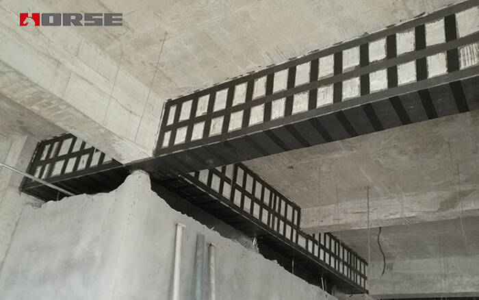 Reinforced beams using unidirectional CFRP fabric