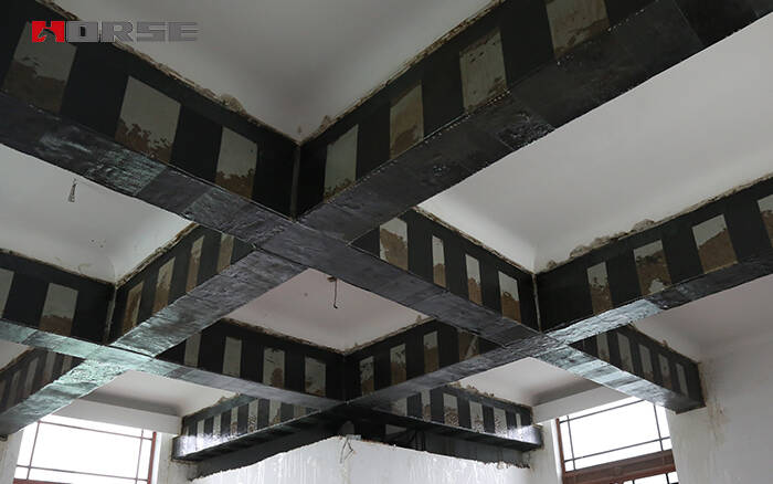 Reinforced beams using unidirectional CFRP fabric